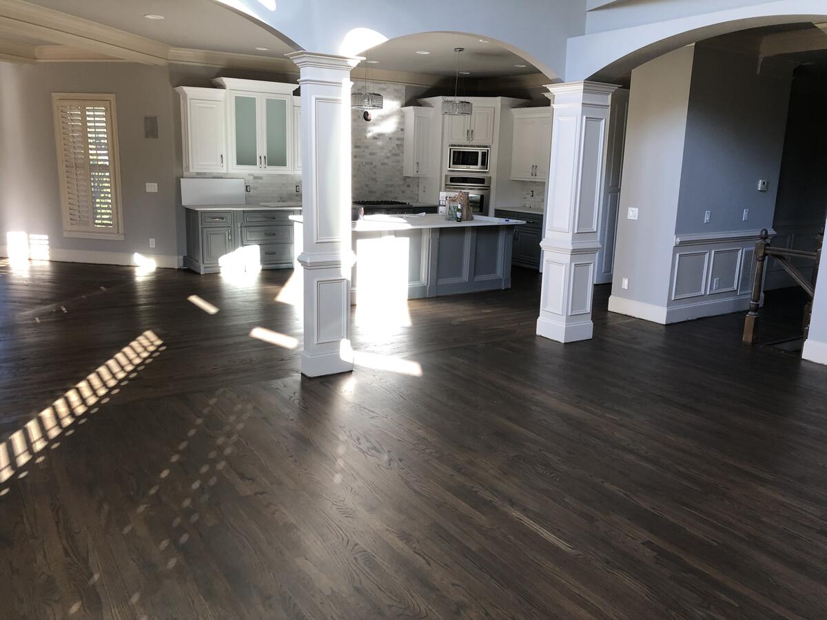 Dark hardwood floors in open floor plan living room